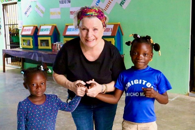 Amigitos founder Siv Mika Engebretsen with some of the children she has given a new life in the Dominican Republic. 